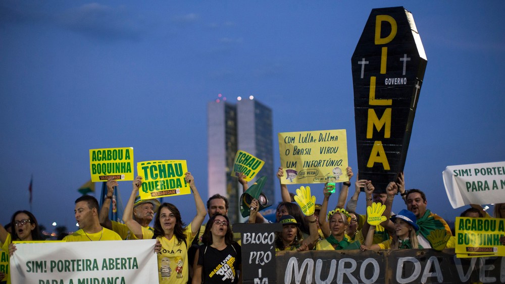 Anti-government demonstrators gather outside Congress in Brasilia, Brazil, Wednesday, May 11, 2016. (Photo by Felipe Dana/AP)