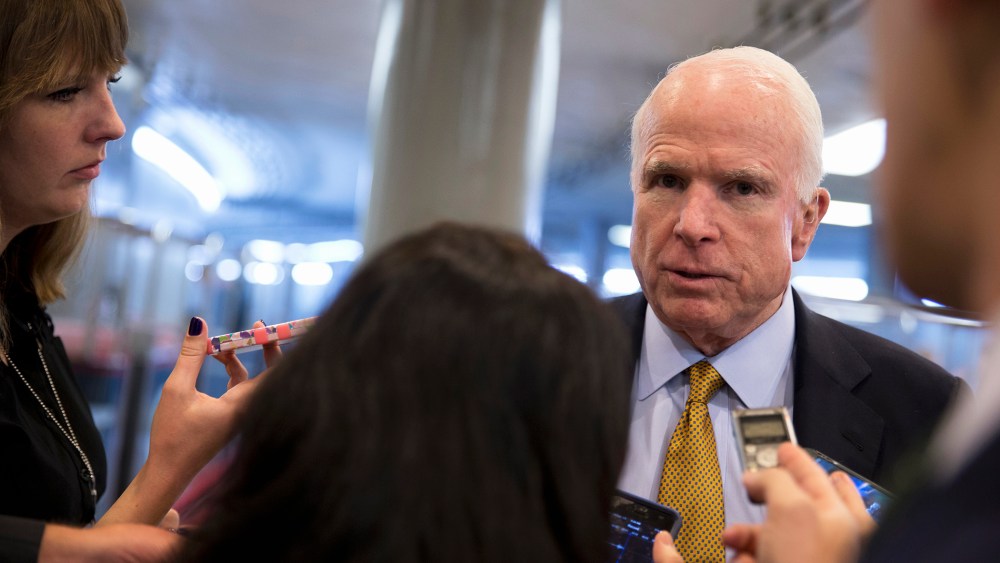 In this Oct. 20, 2015 photo Sen. John McCain, R-Ariz., talks to reporters near the subway on Capitol Hill in Washington, D.C. (Photo by Carolyn Kaster/AP)