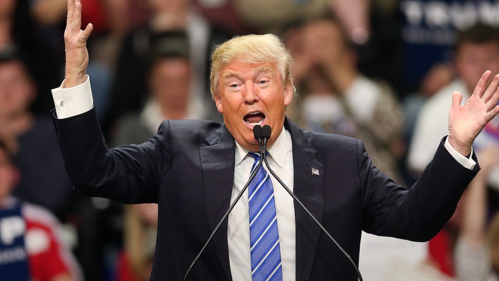 Republican presidential candidate Donald Trump gestures as he speaks at a rally in Florence, S.C. (Photo by John Bazemore/AP)