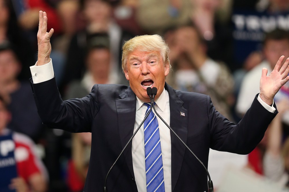 Republican presidential candidate Donald Trump gestures as he speaks at a rally in Florence, S.C. (Photo by John Bazemore/AP)