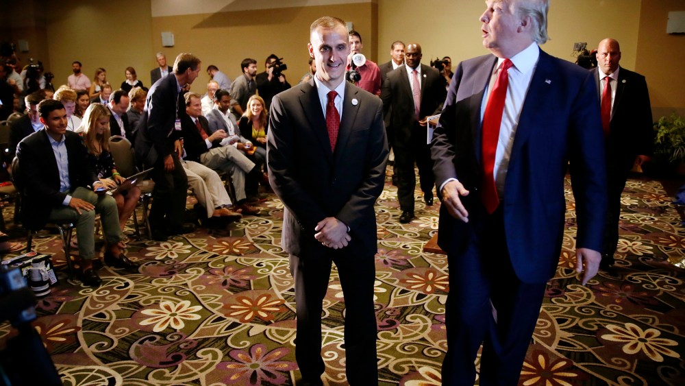 In this Aug. 25, 2015 file photo, Republican presidential candidate Donald Trump, right, walks with his campaign manager Corey Lewandowski after speaking at a news conference in Dubuque, Iowa. (Photo by Charlie Neibergall/AP)