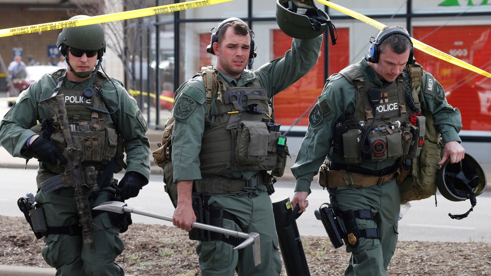 Richmond SWAT team members leave a Greyhound bus station, March 31, 2016 in Richmond, Va. (Photo by Steve Helber/AP)