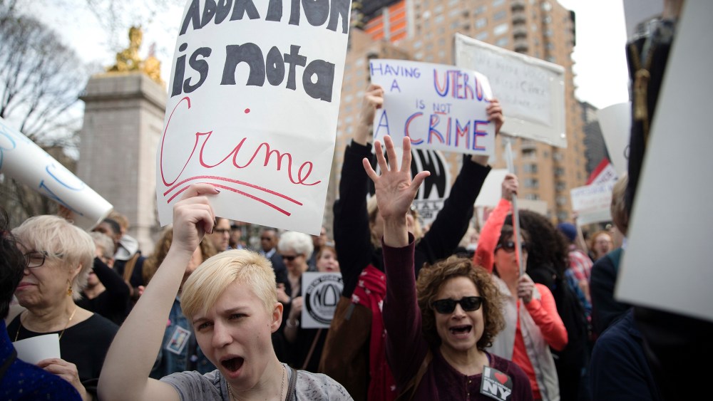 Kayla Forshey, left, participates in a rally to condemn Republican presidential candidate Donald Trump's remarks about women and abortion, March 31, 2016, in New York. (Photo by Mary Altaffer/AP)