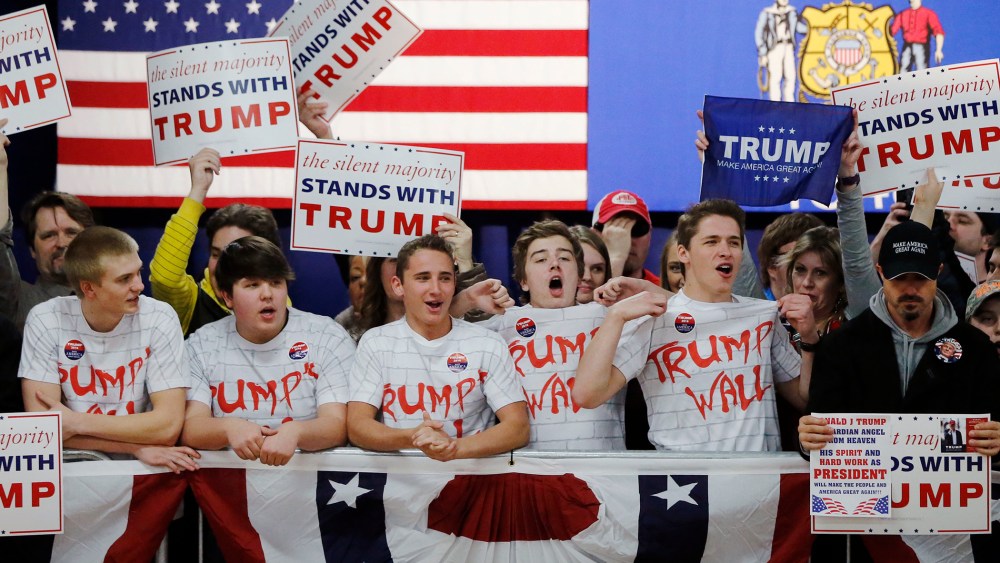 Supporters of Republican presidential candidate, Donald Trump, chant, "Build That Wall," before a town hall, April 2, 2016, in Rothschild, Wis. (Photo by Charles Rex Arbogast/AP)