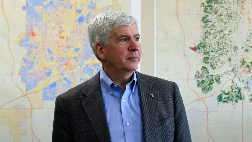 In this Feb. 18, 2016 file photo, Gov. Rick Snyder addresses the media in Flint, Mich. (Photo by Carlos Osorio/AP)