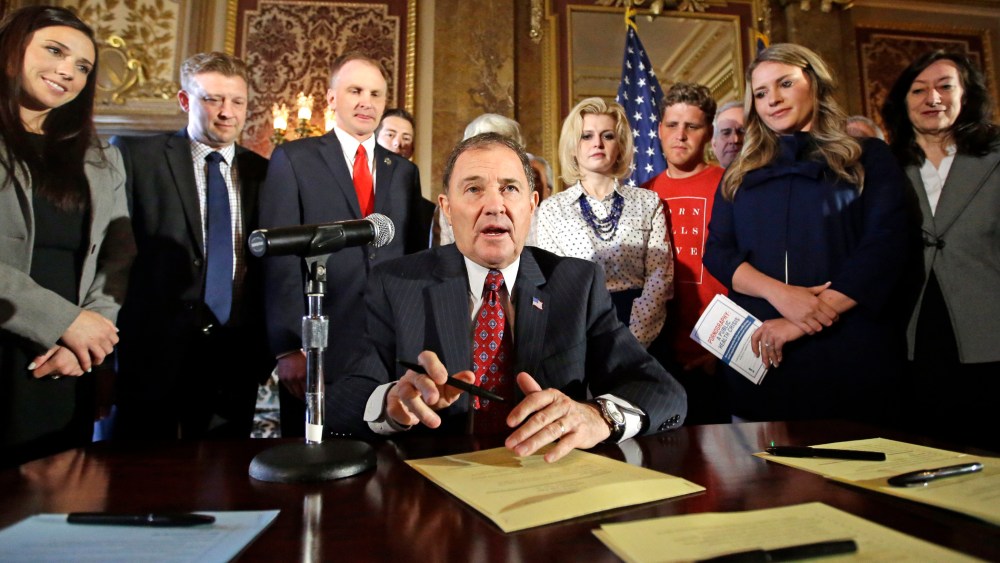 Utah Gov. Gary Herbert looks up during a ceremonial signing of a state resolution declaring pornography a public health crisis, April 19, 2016, in Salt Lake City. (Photo by Rick Bowmer/AP)