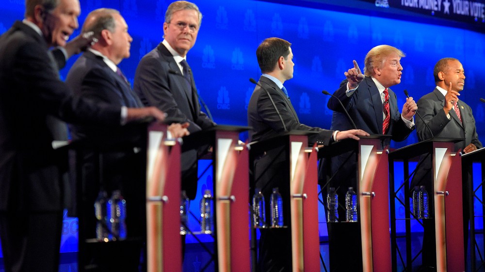 John Kasich, left, and Donald Trump, second from right, argue across fellow candidates during the CNBC Republican presidential debate at the University of Colorado, Oct. 28, 2015, in Boulder, Colo. (Photo by Mark J. Terrill/AP)