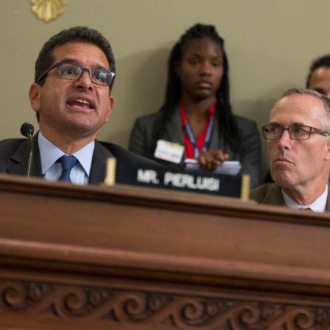 Rep. Jared Huffman, D-Calif. listens at right as Puerto Rico's Resident Commission Pedro Pierluisi, D-Puerto Rico, speaks on Capitol Hill in Washington, May 25, 2016. (Photo by Evan Vucci/AP)