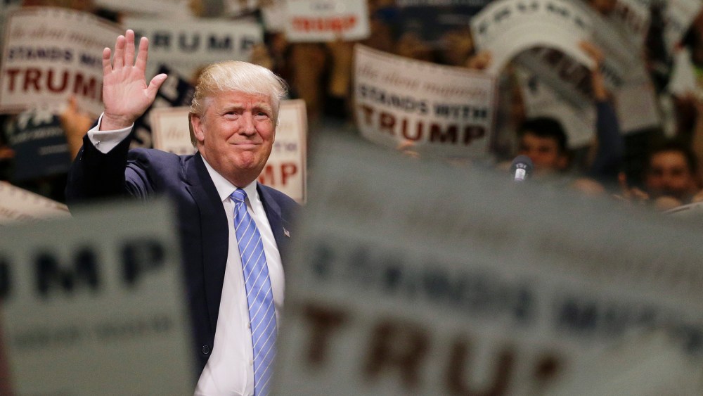 Republican presidential candidate Donald Trump waves to the crowd as he arrives at a rally at the Anaheim Convention Center on May 25, 2016, in Anaheim, Calif. (Photo by Jae C. Hong/AP)
