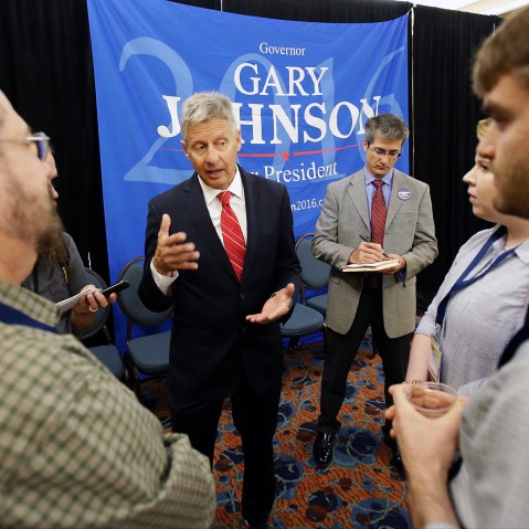 Libertarian presidential candidate Gary Johnson, center, speaks to supporters and delegates at the National Libertarian Party Convention, May 27, 2016, in Orlando, Fla. (Photo by John Raoux/AP)