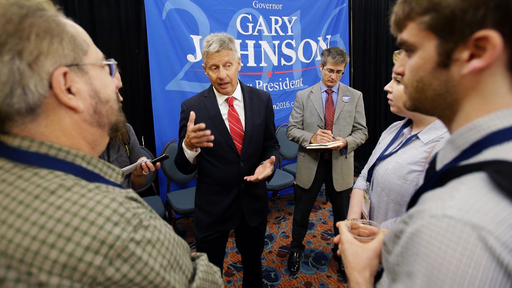 Libertarian presidential candidate Gary Johnson, center, speaks to supporters and delegates at the National Libertarian Party Convention, May 27, 2016, in Orlando, Fla. (Photo by John Raoux/AP)