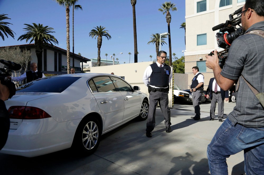 Security is tight as a car carrying Enrique Marquez Jr. arrives at U.S. District Court in Riverside, Calif., Dec. 17, 2015. (Photo by Nick Ut/AP)