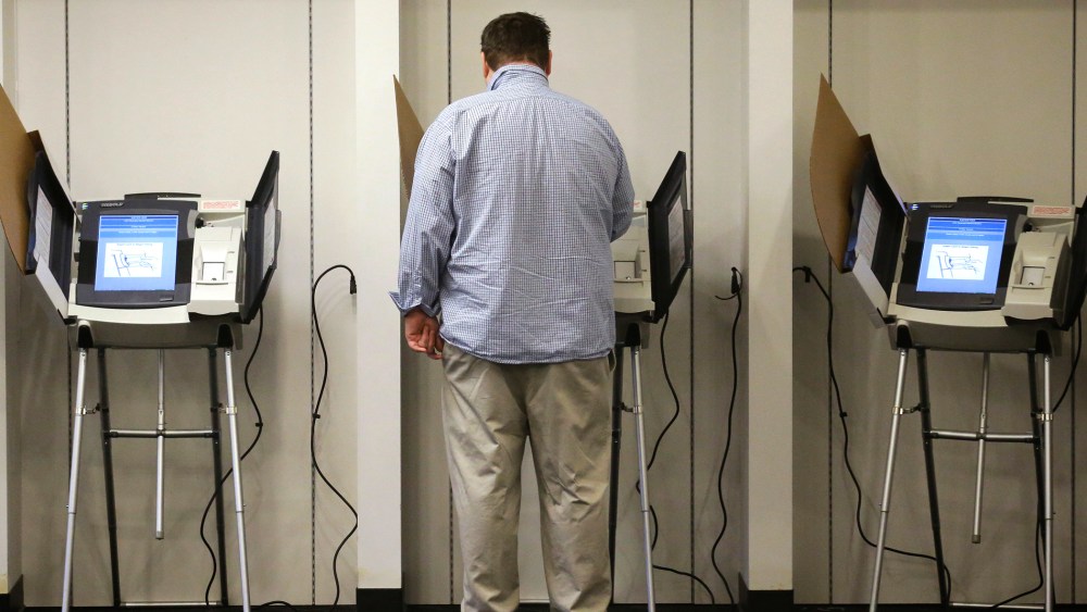 A man votes  in Salt Lake City, Utah. (Photo by Rick Bowmer/AP)