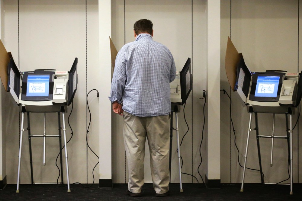 A man votes in Salt Lake City, Utah. (Photo by Rick Bowmer/AP)