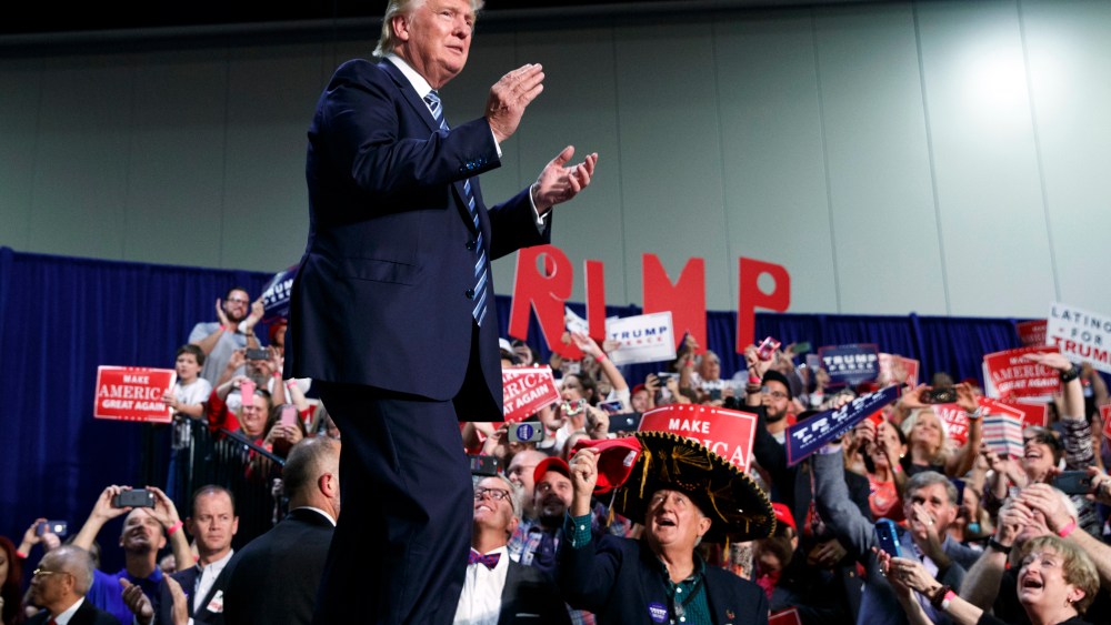 Republican presidential candidate Donald Trump arrives to speak at a campaign rally, Oct. 14, 2016, in Charlotte, N.C. (Photo by Evan Vucci/AP)