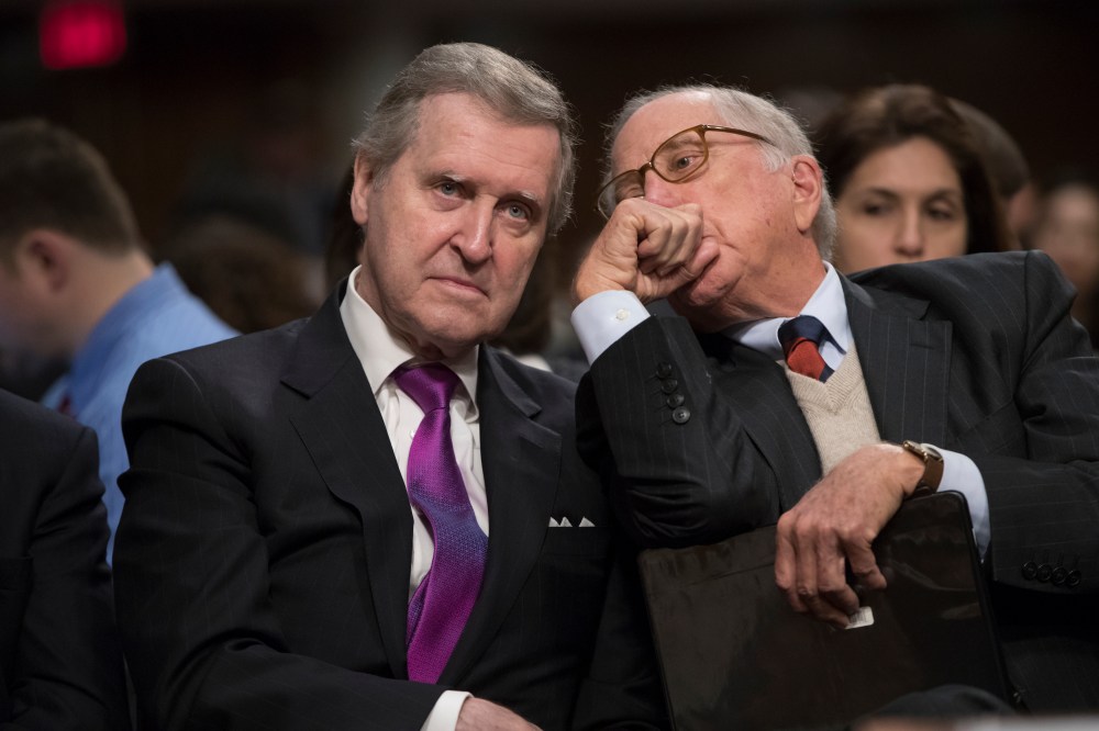 Former Maine Senator and former Defense Secretary William Cohen, left, confers with former Georgia Sen. Sam Nunn as they listen to testimony on Capitol Hill in Washington, Thursday, Jan. 12, 2017.