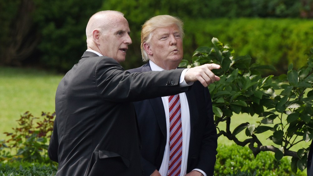 Keith Schiller, deputy assistant to the president and director of Oval Office operations talks to President Donald Trump during a ceremony to welcome the 2016 NCAA Football National Champions The Clemson Tigers on the South Lawn of the White House on June