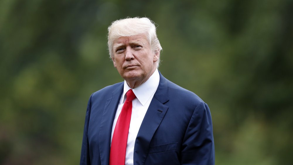 President Donald Trump walks to the White House as he arrives on the South Lawn, Monday, Aug. 14, 2017, in Washington.