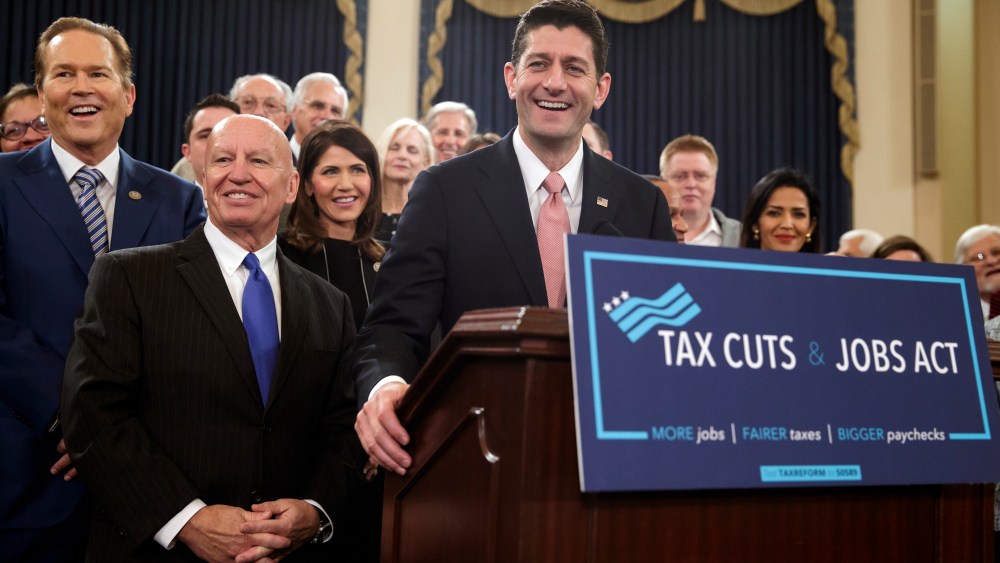 Speaker of the House Paul Ryan, R-Wis., joined by, from left, Rep. Vern Buchanan, R-Fla., House Ways and Means Committee Chairman Kevin Brady, R-Texas, and Rep. Kristi Noem, R-S.D., smiles as they unveil the GOP's tax overhaul, Nov. 2, 2017.
