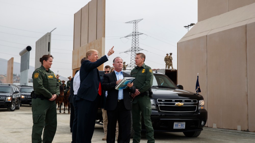 President Donald Trump reviews border wall prototypes, Tuesday, March 13, 2018, in San Diego.