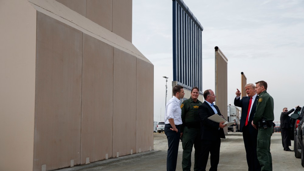 President Donald Trump reviews border wall prototypes, Tuesday, March 13, 2018, in San Diego.