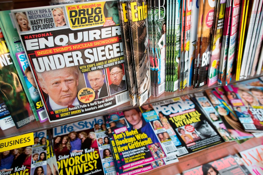 This July 12, 2017, file photo shows the cover of an issue of the National Enquirer featuring President Donald Trump at a store in New York.