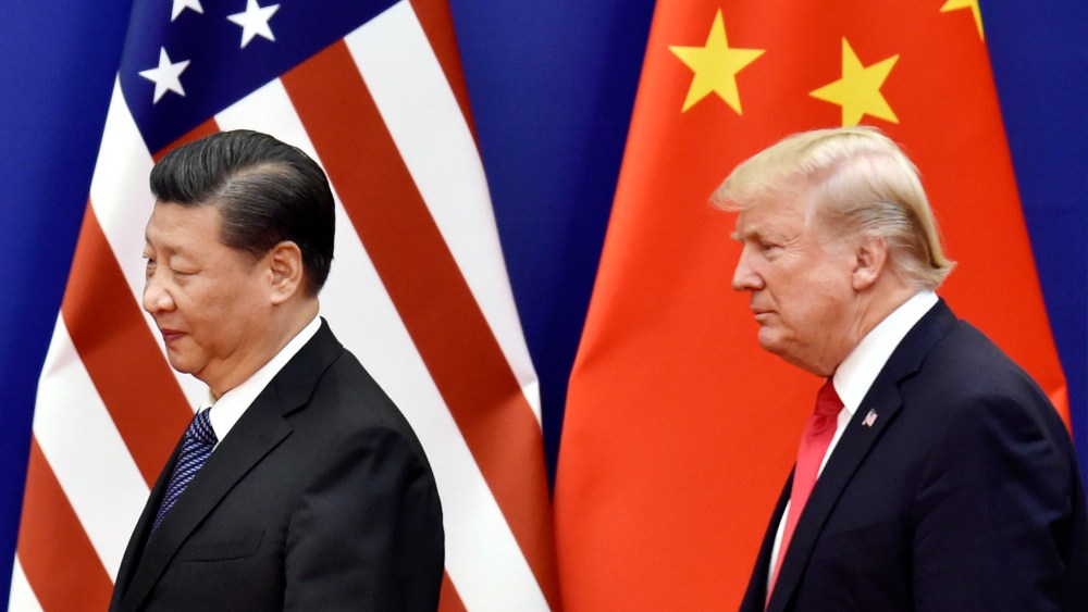 File photo taken in November 2017 shows U.S. President Donald Trump and Chinese President Xi Jinping at the Great Hall of the People in Beijing.