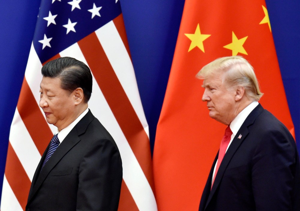File photo taken in November 2017 shows U.S. President Donald Trump and Chinese President Xi Jinping at the Great Hall of the People in Beijing.