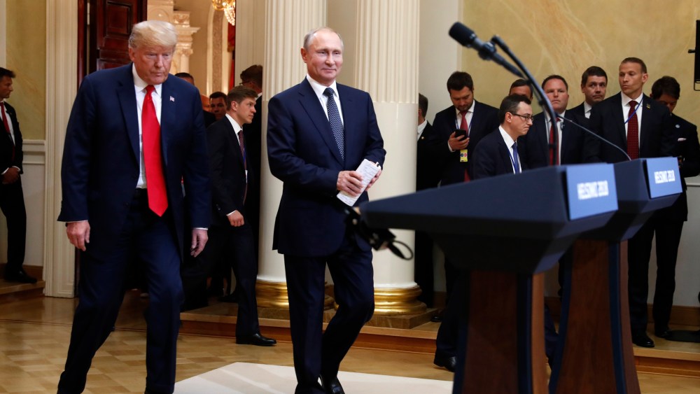 U.S. President Donald Trump, left, and Russian President Vladimir Putin arrive for a press conference after the meeting of U.S. President Donald Trump and Russian President Vladimir Putin at the Presidential Palace in Helsinki, Finland, Monday, July 16, 2