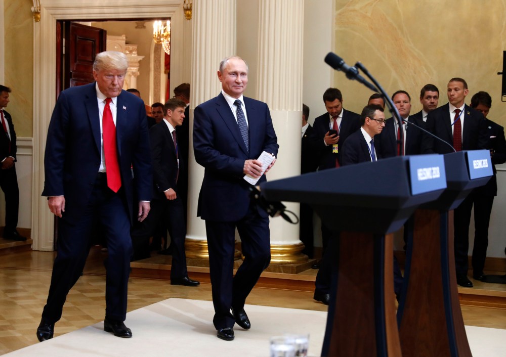 U.S. President Donald Trump, left, and Russian President Vladimir Putin arrive for a press conference after the meeting of U.S. President Donald Trump and Russian President Vladimir Putin at the Presidential Palace in Helsinki, Finland, Monday, July 16, 2