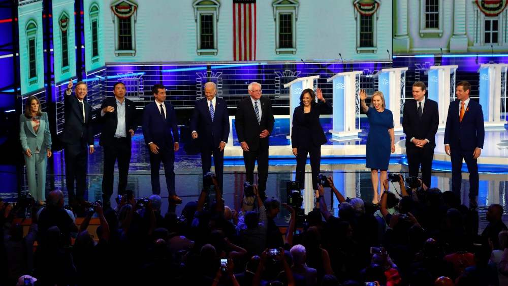 Democratic presidential candidates wave as they enter the stage for the second night of the Democratic primary debate hosted by NBC News at the Adrienne Arsht Center for the Performing Arts, Thursday, June 27, 2019, in Miami.