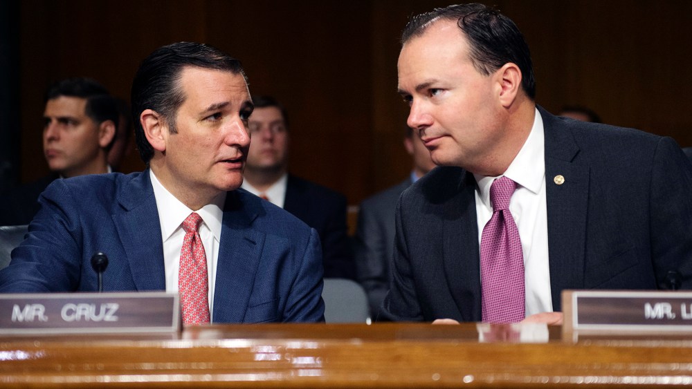 Sen. Ted Cruz, R-Texas, and Sen. Mike Lee, R-Utah, confer before a Senate Judiciary hearing to examine the Administration's immigration enforcement policies, in Washington, July 21, 2015. (Photo by Molly Riley/AP)