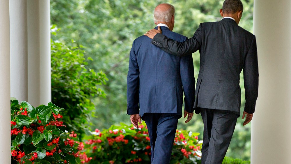 President Barack Obama walks with Vice President Joe Biden back to the Oval Office of the White House in Washington, D.C., June 25, 2015. (Photo by Pablo Martinez Monsivais/AP)