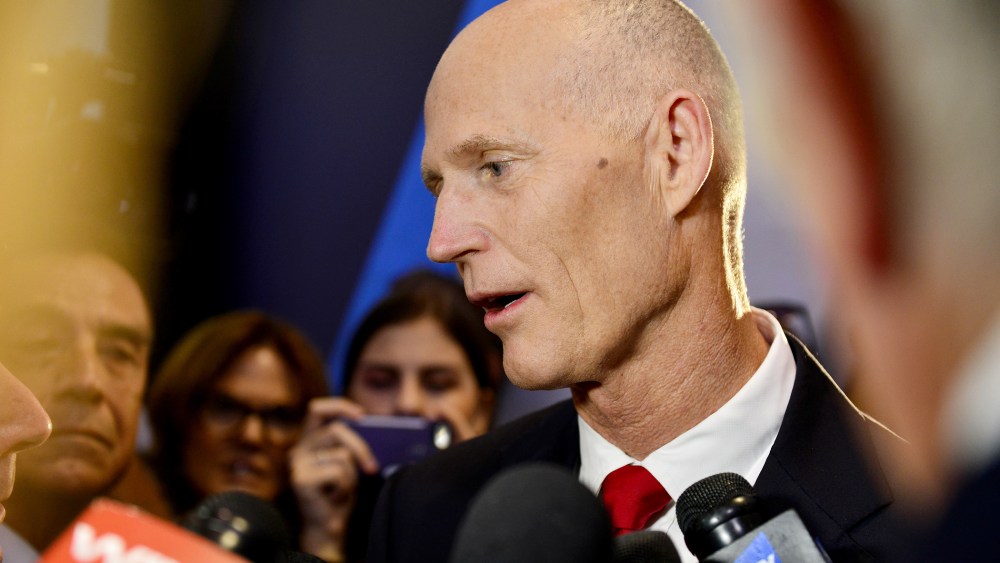 Fla. Gov. Rick Scott speaks with the media before the Republican presidential debate on the campus of the University of Miami on March 10, 2016 in Coral Gables, Fla. (Photo by Johnny Louis/SIPA/AP)