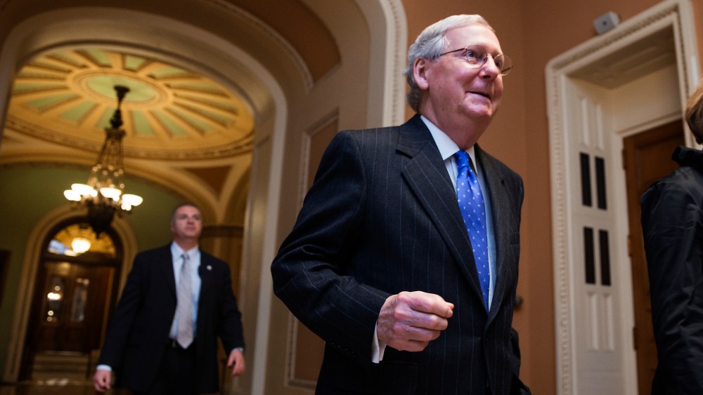 Senate Majority Leader Mitch McConnell, R-Ky., walks from the chamber as Republicans pushed legislation toward Senate approval to defund Planned Parenthood and the ACA, on Capitol Hill in Washington, Dec. 3, 2015. (Photo by J. Scott Applewhite/AP)