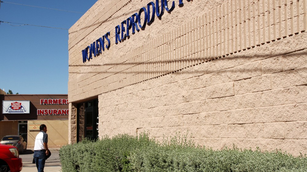 A man walks into a clinic that offers abortions in Santa Teresa, N.M., Friday, Oct. 3, 2014. Many similar clinics have been closed in recent years. (Photo by Juan Carlos Llorca/AP)
