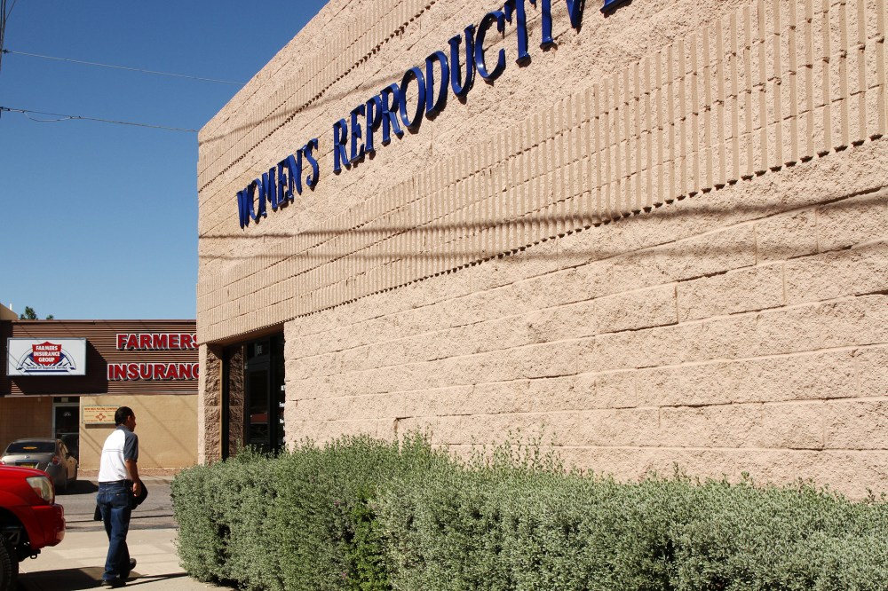 A man walks into a clinic that offers abortions in Santa Teresa, N.M., Friday, Oct. 3, 2014. Many similar clinics have been closed in recent years. (Photo by Juan Carlos Llorca/AP)