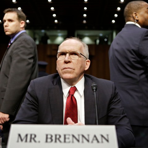 CIA Director nominee John Brennan, flanked by security, arrives on Capitol Hill in Washington, D.C., Feb. 7, 2013. (Photo by J. Scott Applewhite/AP)
