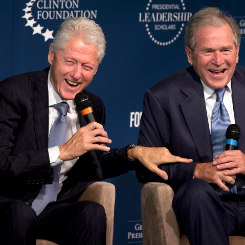 This Sept. 8, 2014, file photo shows former Presidents Bill Clinton, left, and George W. Bush, as they laugh together during an event in Washington, D.C. (Photo by Jacquelyn Martin/AP)