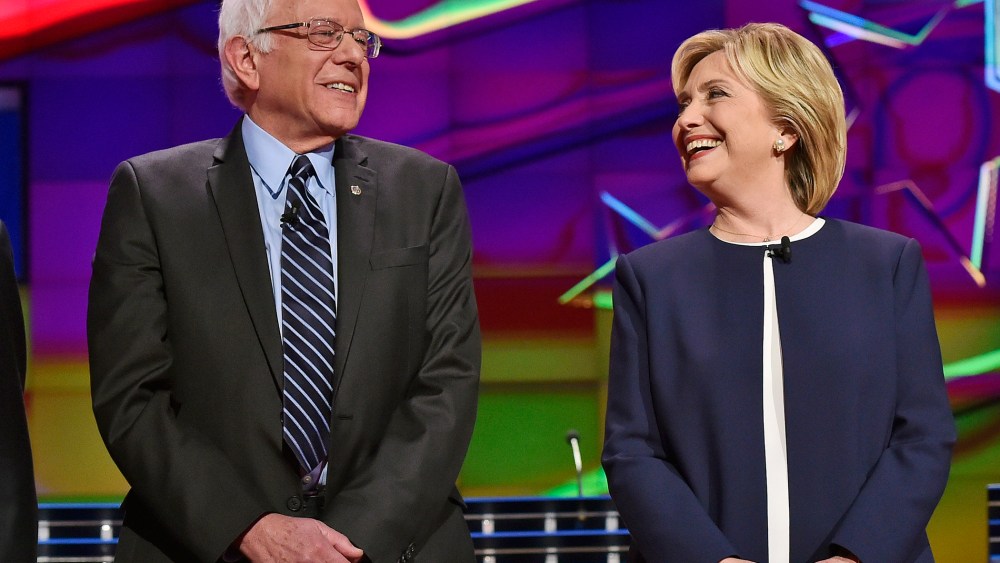 Democratic presidential candidates Sen. Bernie Sanders and Hillary Rodham Clinton talk before the CNN Democratic presidential debate on Oct. 13, 2015, in Las Vegas, Nev. (Photo by David Becker/AP)