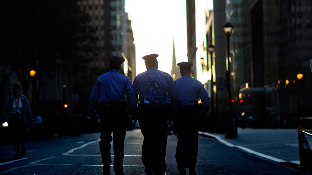 Police walk along Arch Street, Sept. 27, 2015, in Philadelphia, Pa. (Photo by David Goldman/AP)