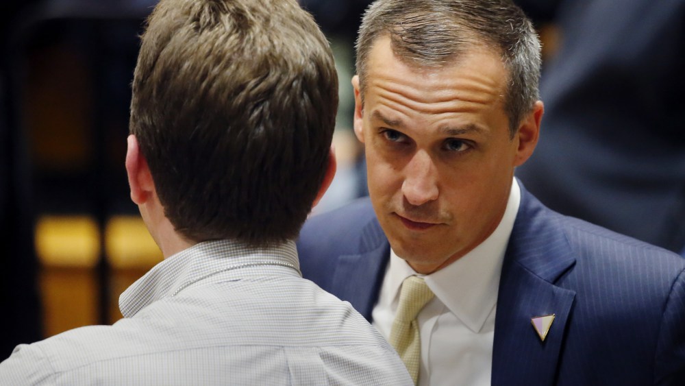 In this photo taken April 3, 2016, Corey Lewandowski talks to a member of the media at Nathan Hale High School in West Allis, Wis. (Photo by Charles Rex Arbogast/AP)