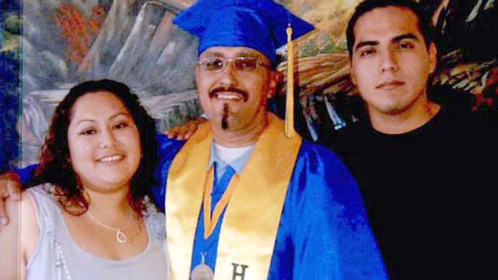 This December, 2013 photo shows Luis Vargas with his daughter and son at his community college graduation ceremony held within the walls of a California state prison in Blythe, Calif. (Photo by California Innocence Project/AP)