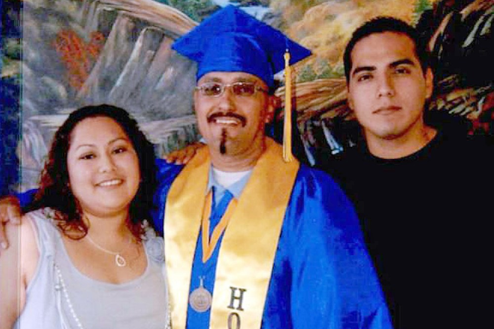 This December, 2013 photo shows Luis Vargas with his daughter and son at his community college graduation ceremony held within the walls of a California state prison in Blythe, Calif. (Photo by California Innocence Project/AP)