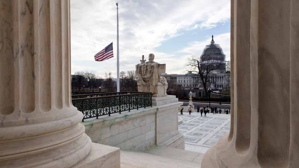 The U.S. flag flies at half-staff at the Supreme Court, Feb. 17, 2016, in honor of Supreme Court Justice Antonin Scalia, who died last weekend at age 79. (Photo by J. Scott Applewhite/AP)
