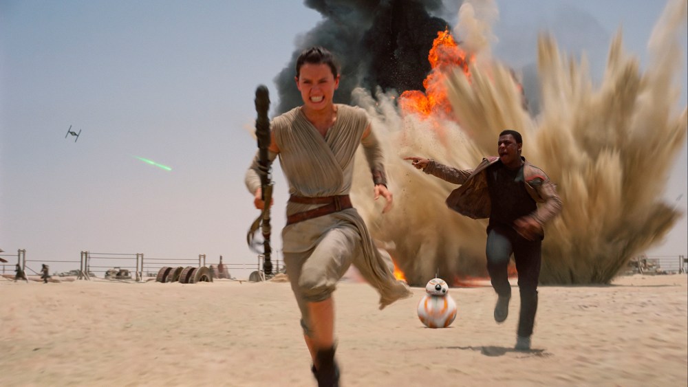 This photo provided by Disney shows Daisy Ridley as Rey, left, and John Boyega as Finn, in a scene from the new film, "Star Wars: The Force Awakens." (Photo by Film Frame/Disney/Lucasfilm/AP)