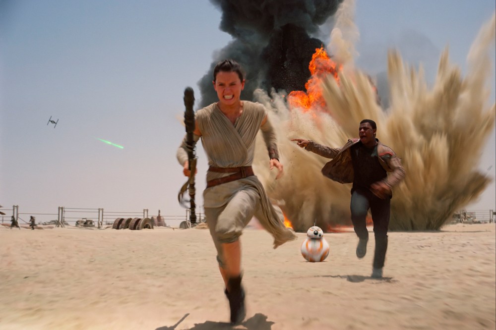 This photo provided by Disney shows Daisy Ridley as Rey, left, and John Boyega as Finn, in a scene from the new film, "Star Wars: The Force Awakens." (Photo by Film Frame/Disney/Lucasfilm/AP)