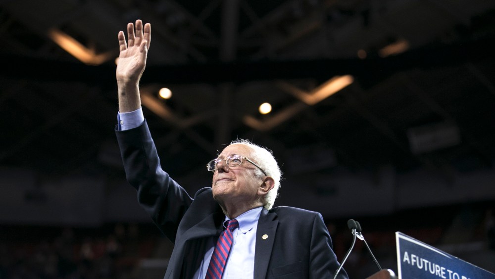 Democratic presidential candidate Sen. Bernie Sanders, I-Vt., waves to the crowd after speaking on March 20, 2016, at a campaign rally in Seattle, Wash. (Photo by Stephen Brashear/AP)