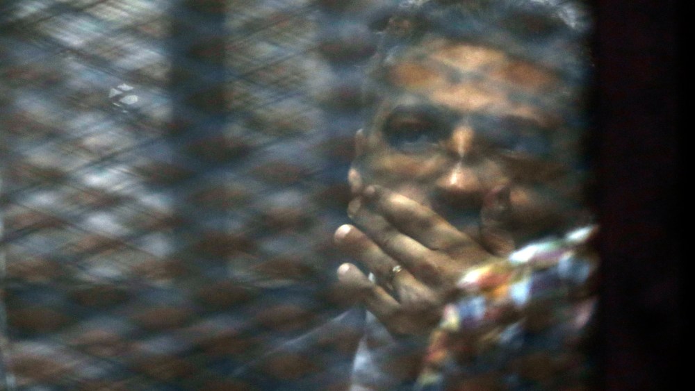 Canadian Al-Jazeera English journalist Mohammed Fahmy, listens to his verdict in a soundproof glass cage inside a makeshift courtroom in Tora prison in Cairo, Egypt, Aug. 29, 2015. (Photo by Amr Nabil/AP)