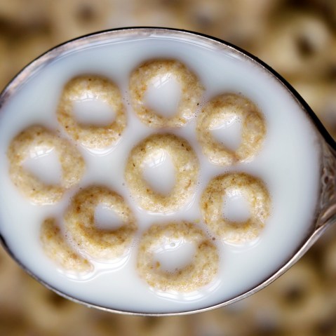 This June 15, 2011 file photo shows a spoonful of Honey Nut Cheerios in Pembroke, N.Y. (Photo by David Duprey/File/AP)